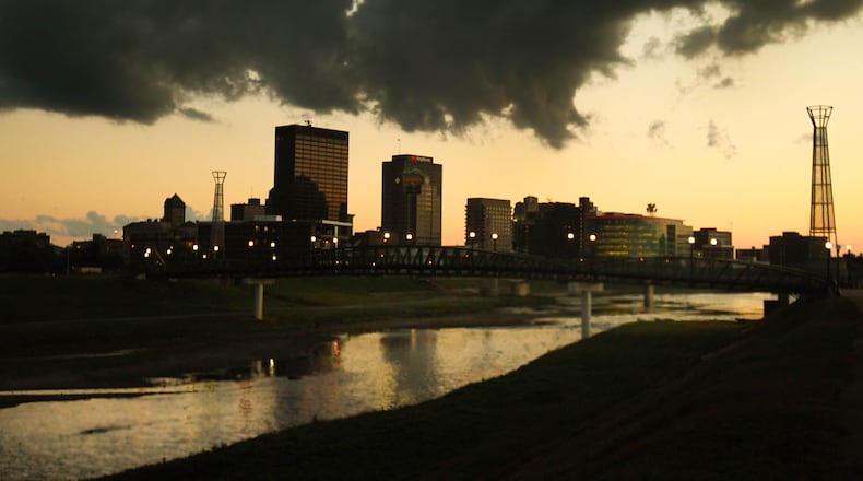 A dramatic cloud cover moved across the Dayton skyline Friday evening as the sun set, part of a front that brought cooler temperatures to the Miami Valley. JIM WITMER / STAFF