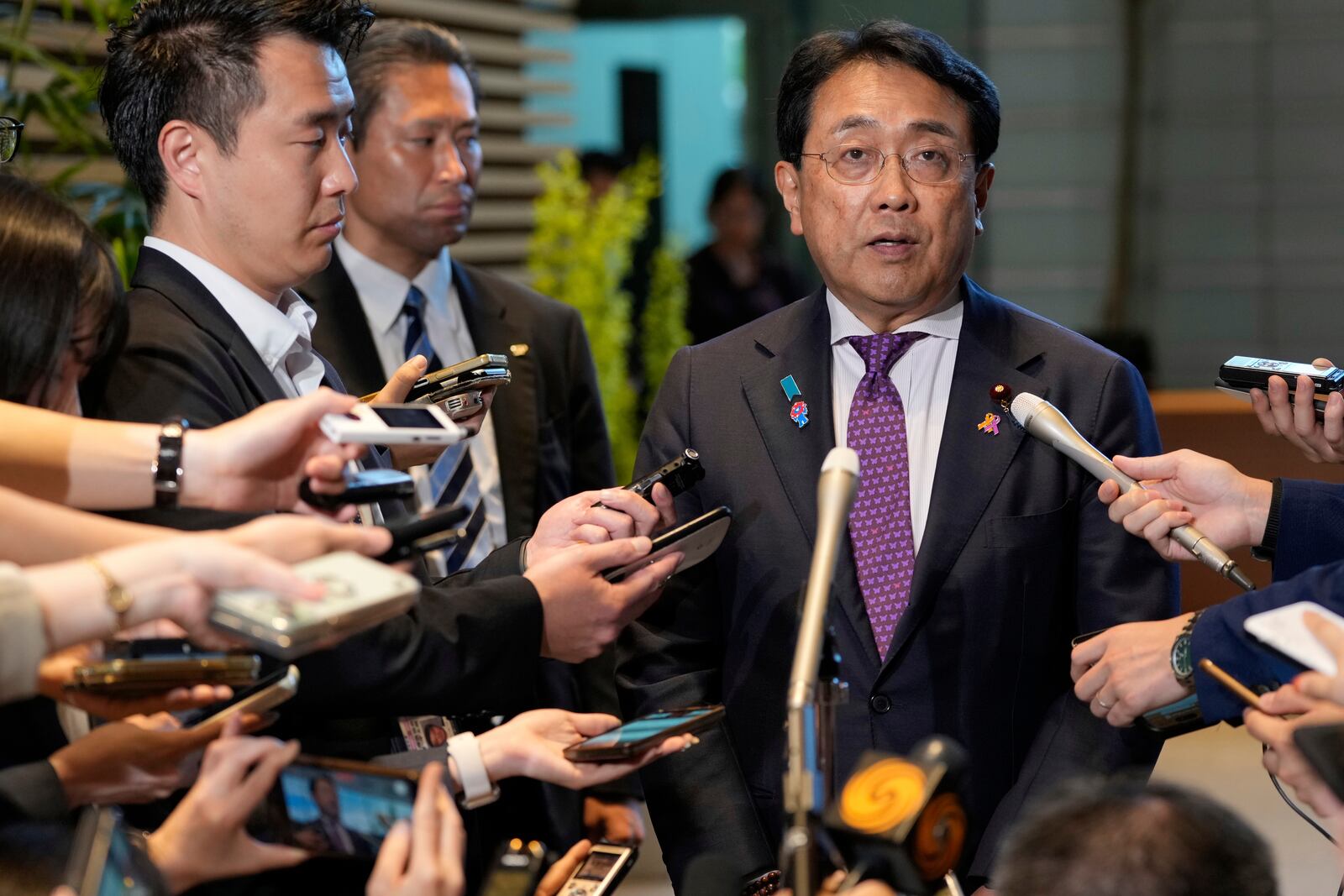 Japan's chief tariff negotiator Ryosei Akazawa speaks to the media after a meeting between Japanese Prime Minister Shigeru Ishiba and U.S. Treasury Secretary Scott Bessent at the prime minister's office in Tokyo, Japan, Friday, July 18, 2025.(AP Photo/Shuji Kajiyama, Pool)