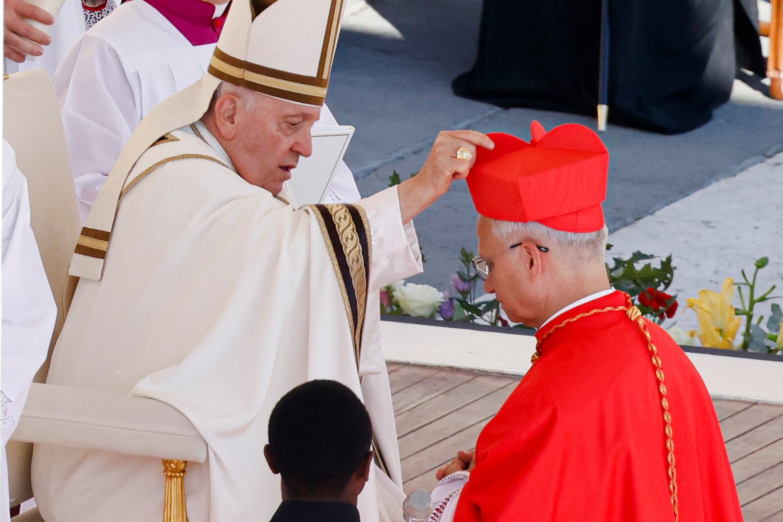 FILE - Newly elected Cardinal Robert Francis Prevost, Prefect of the Dicastery for Bishops, right, receives his biretta from Pope Francis as he is elevated in St. Peter's Square at the Vatican, Saturday, Sept. 30, 2023. (AP Photo/Riccardo De Luca, file)