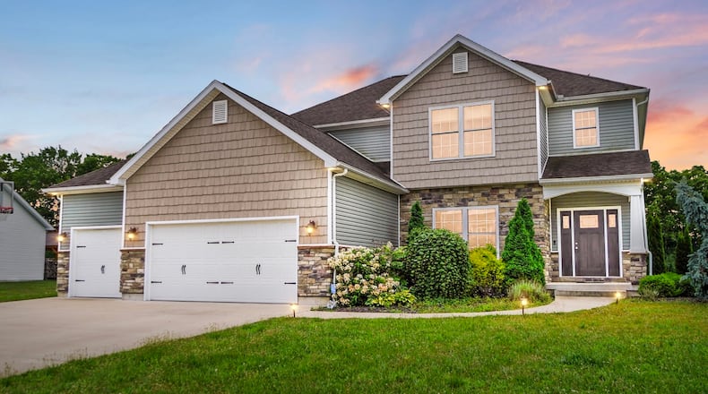 This Troy two story has a three car garage and finished daylight basement. It sits on a third acre lot with trees to the rear. CONTRIBUTED