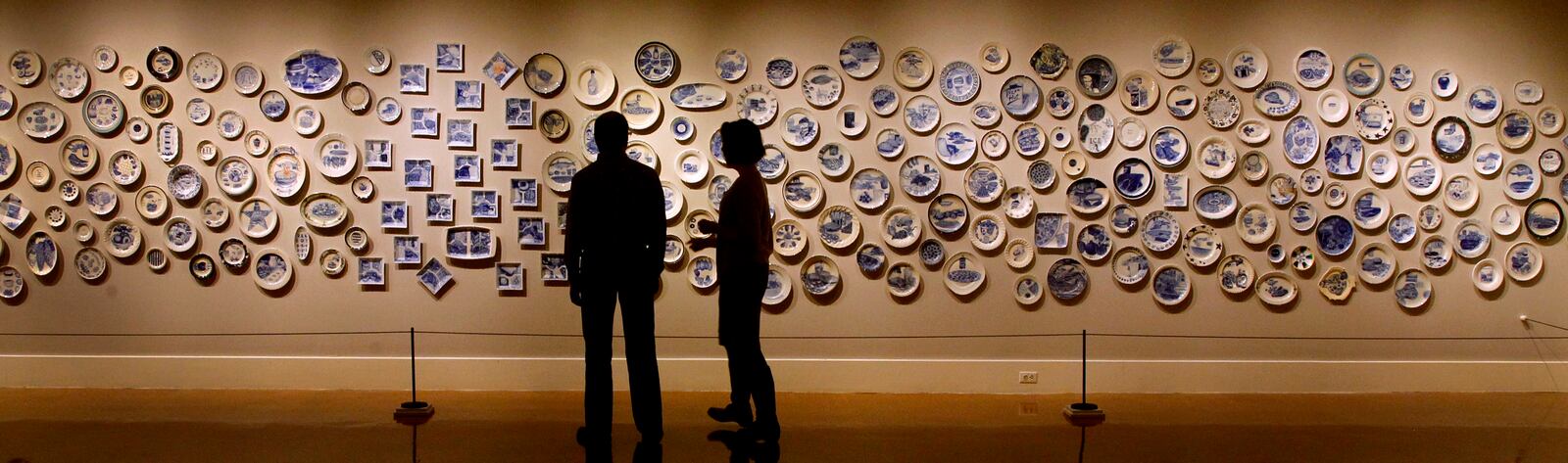 Artist Julie Green's "The Last Supper: 600 Plates Illustrating Final Meals of U.S. Death Row Inmates," showcased hand painted plates depicting the final meal request of death row inmates. LISA POWELL / STAFF
