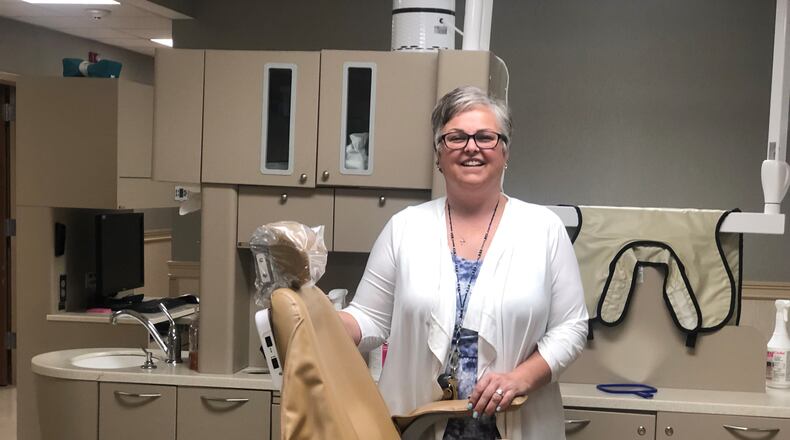 Michelle Collier, chief operating officer of Good Neighbor House, in the nonprofit's dental clinic. CORNELIUS FROLIK / STAFF