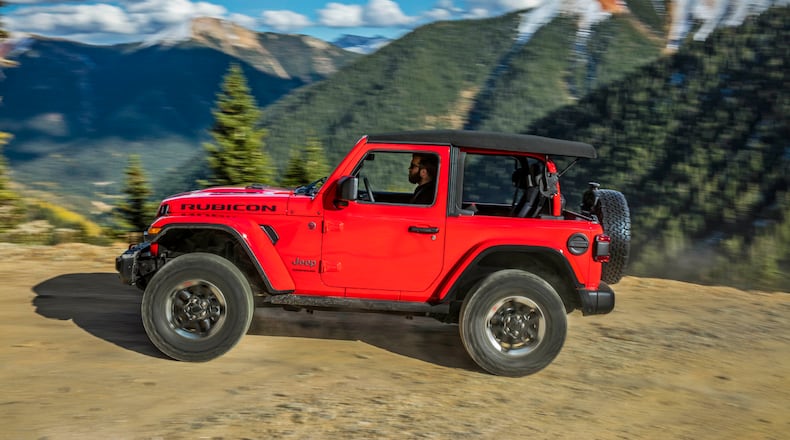 This photo from Jeep shows the 2021 Jeep Wrangler in its two-door version, a rough and rugged SUV that prioritizes off-road ability above all else. (Courtesy of FCA US via AP)