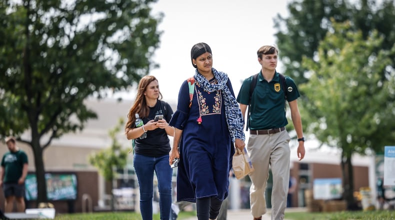 Wright State University students walk to class Wednesday September 14, 2022. Wright State University and Central State are collaborating on a semiconductor lab. JIM NOELKER/STAFF
