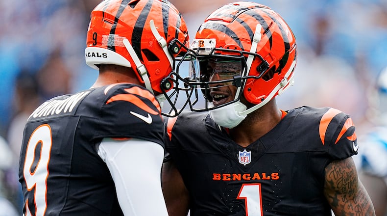 Cincinnati Bengals wide receiver Ja'Marr Chase celebrates after scoring with quarterback Joe Burrow against the Carolina Panthers during the first half of an NFL football game, Sunday, Sept. 29, 2024, in Charlotte, N.C. (AP Photo/Rusty Jones)