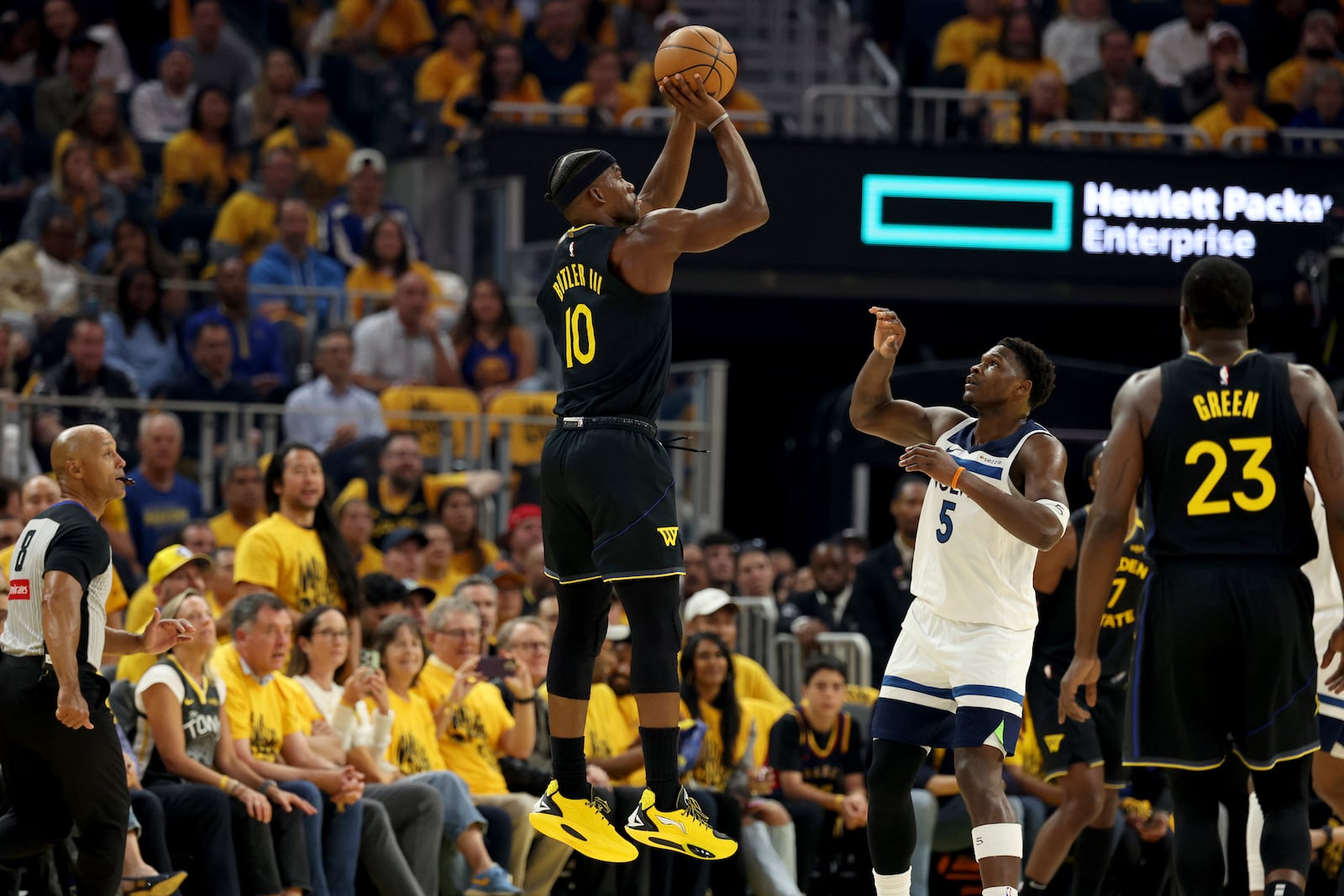 Golden State Warriors forward Jimmy Butler III (10) goes up to shoot against Minnesota Timberwolves guard Anthony Edwards (5) during the first half of Game 4 in the Western Conference semifinals of the NBA basketball playoffs Monday, May 12, 2025, in San Francisco. (AP Photo/Jed Jacobsohn)