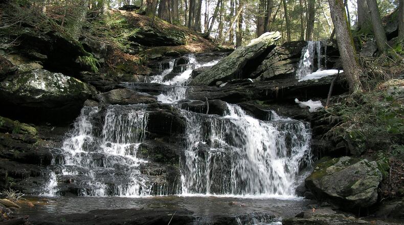 Day Pond Brook cascades over a series of waterfalls through a dark hemlock forest on its journey to the Salmon River. An old abandoned road and blue-blazed trails take visitors to the falls and through Day Pond State Park and the Salmon River State Forest.(Hartford Courant /TNS)