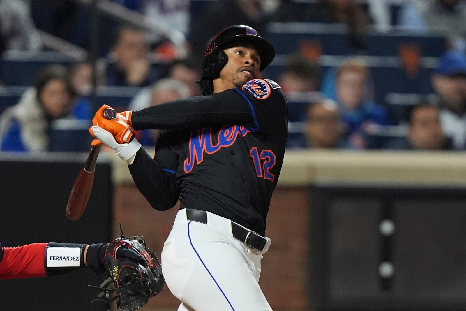 New York Mets' Francisco Lindor (12) follows through on a walk-off home run during the ninth inning of a baseball game against the St. Louis Cardinals Friday, April 18, 2025, in New York. (AP Photo/Frank Franklin II)