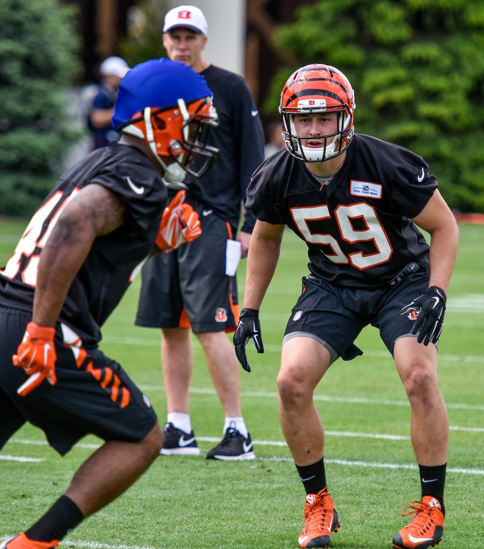 Nick Vigil (59) defends Darien Harris (45) during rookie camp for the Cincinnati Bengals Friday, May 6 at the practice fields next to Paul Brown Stadium in Cincinnati. NICK GRAHAM/STAFF