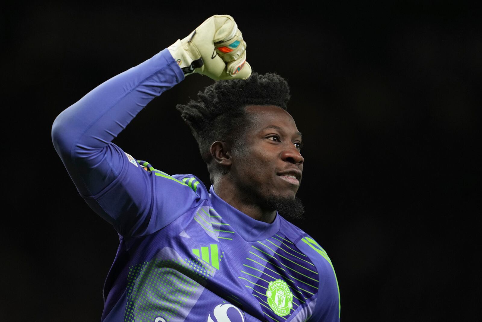 Manchester United's goalkeeper Andre Onana celebrates during the Europa League quarter final second leg soccer match between Manchester United and Olympique Lyon in Manchester, Britain, Thursday, April 17, 2025. (AP Photo/Jon Super)