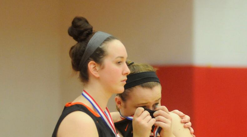 Haley Hutchins (left) and Michaela Rhoades take a hard loss to Mason in a D-I district final at Princeton on Sat., Marcy 3, 2018. MARC PENDLETON / STAFF