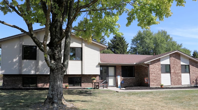 Sitting on just under a half-acre, the brick-and-vinyl home at 973 Princewood Ave. in Washington Twp. has about 3,171 square feet of living space. Listed for $399,996 by Berkshire Hathaway Home Professional Services, the property includes a two-car garage, a paver-brick walkway that wraps around to the paver patio and deep fenced back yard. CONTRIBUTED