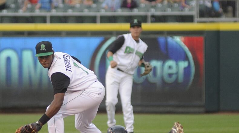Cory Thompson initially was an infielder with the Dragons in the 2015 season. Thompson tags out Carter Burgess of the Hot Rods following a relay throw from left fielder Jimmy Pickens (center). Dayton hosted Bowling Green in a minor-league baseball game at Fifth Third Field on Thursday, July 9, 2015. MARC PENDLETON / STAFF