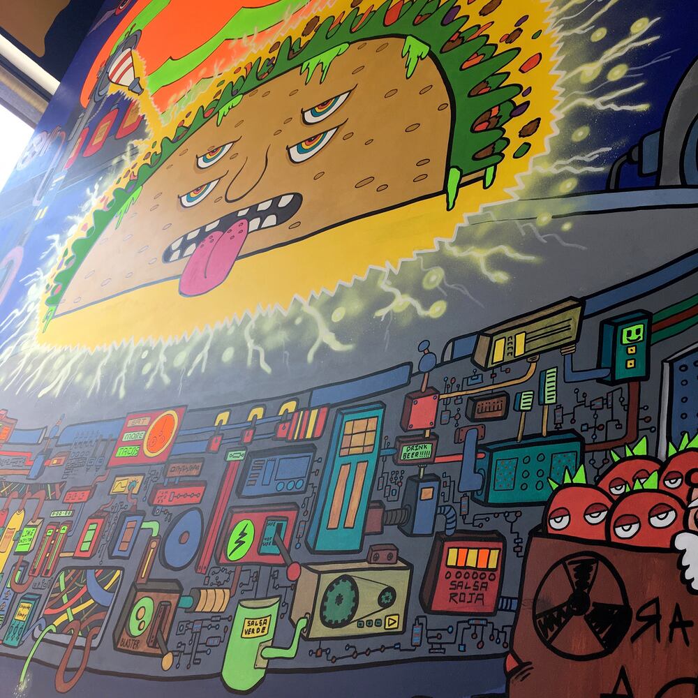 PHOTOS: Wild and wacky murals take over new restaurant at The Greene