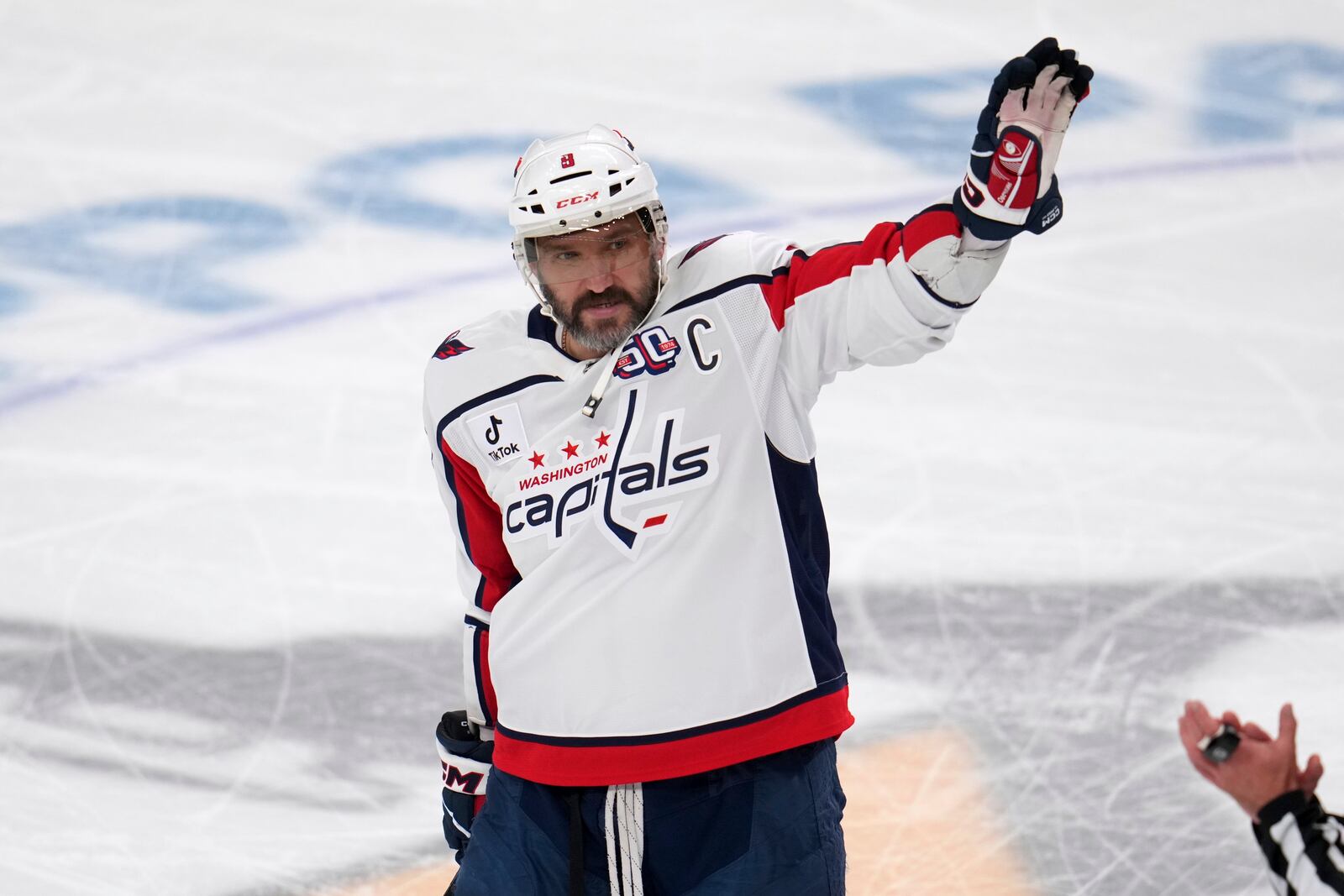 Washington Capitals' Alex Ovechkin acknowledges fans during a scoreboard tribute during the first period of an NHL hockey game against the Pittsburgh Penguins in Pittsburgh, Thursday, April 17, 2025. (AP Photo/Gene J. Puskar)