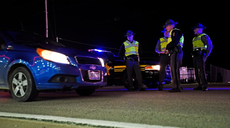 The Butler County OVI Task Force along with the Ohio State Highway Patrol, the Butler County Sheriff’s office and other local law enforcement agencies set up a sobriety checkpoint to check for impaired drivers Friday, Nov. 20 on US-127 in New Miami. NICK GRAHAM/STAFF