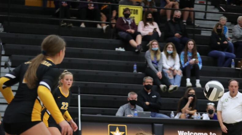 Centerville senior libero reaches to hit a shot during a match this season. Barry Burtenshaw/CONTRIBUTED