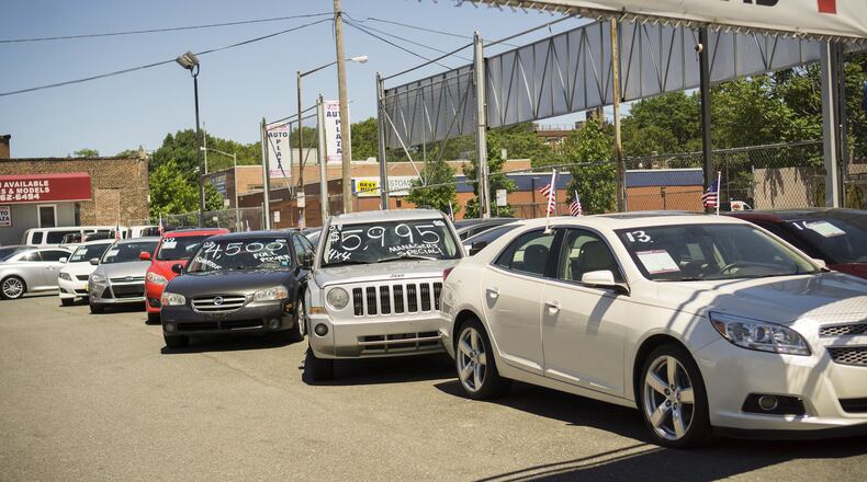 A dealer in used cars in the Woodside neighborhood of Queens in New York. Many “buy here, pay here” car dealers use starter interrupt devices called “kill switches” that will turn off the car if the owner misses a payment. (Richard B. Levine/Sipa USA/TNS)
