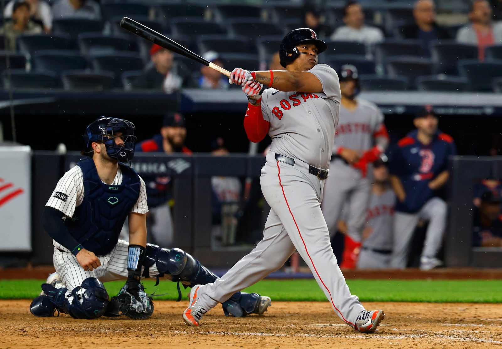 Boston Red Sox designated hitter Rafael Devers (11) follows through on a home run during the ninth inning of a baseball game against the New York Yankees, Sunday, June 8, 2025, in New York. (AP Photo/Noah K. Murray)