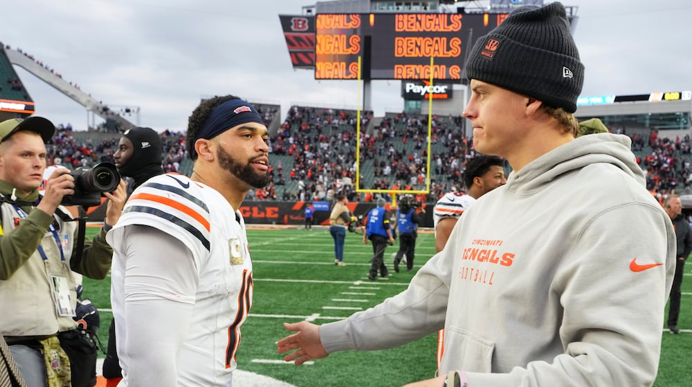 Cincinnati Bengals quarterback Joe Burrow (9), right, greets Chicago Bears quarterback Caleb Williams (18) after an NFL football game, Sunday, Nov. 2, 2025, in Cincinnati. (AP Photo/Jeff Dean)