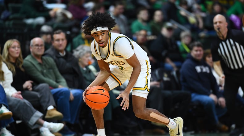 Wright State University guard TJ Burch dribbles the ball during their game against Miami on Tuesday, Dec. 16 at the Ervin J. Nutter Center. KYLE HENDRIX / CONTRIBUTED