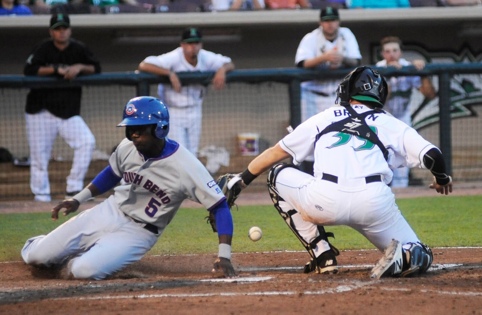Dragons catcher Cassidy Brown couldn't hold on to a tag out of Cubs infielder Andruw Monasterio. The Dragons hosted South Bend at Dayton's Fifth Third Field in a Class A minor-league baseball game on Monday, July 10, 2017. MARC PENDLETON / STAFF