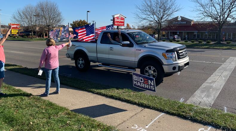 A truck displaying support for President Donald Trump blares its horn as it drives by a rally by supporters of President-Elect Joe Biden on Sunday, Nov. 8. JOSH SWEIGART/STAFF