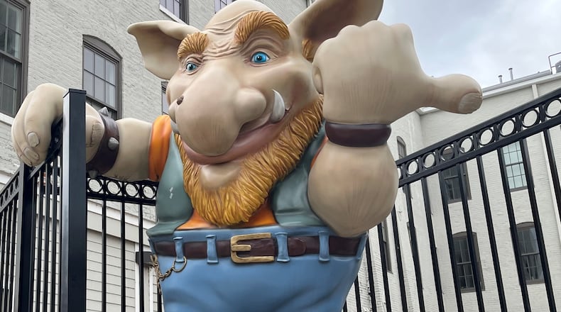 The giant troll welcomes visitors to the Troll Pub at the Wheelhouse at 216 Wayne Ave. near the Oregon District. The Wheelhouse, a former manufacturing facility, was turned into housing and first-floor commercial spaces with the help of state historic tax credits. CORNELIUS FROLIK / STAFF