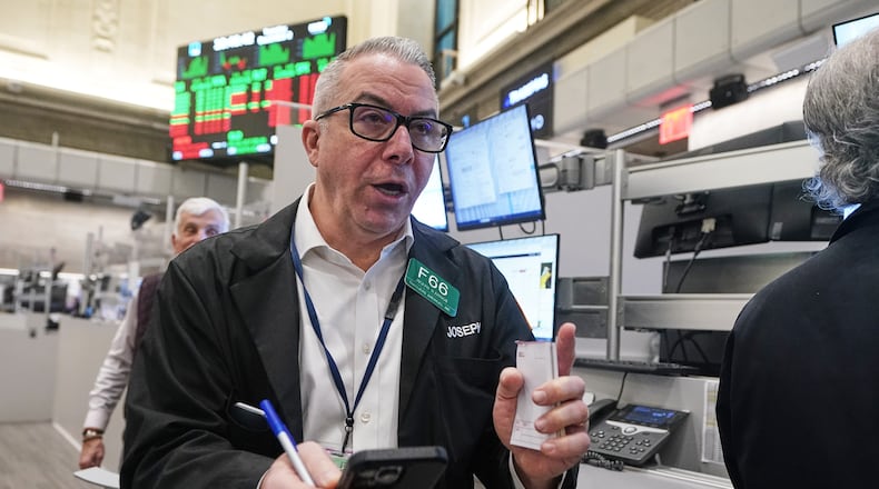 Options trader Joseph D'Arrigo works on the floor of the New York Stock Exchange, Tuesday, Dec. 2, 2025. (AP Photo/Richard Drew)