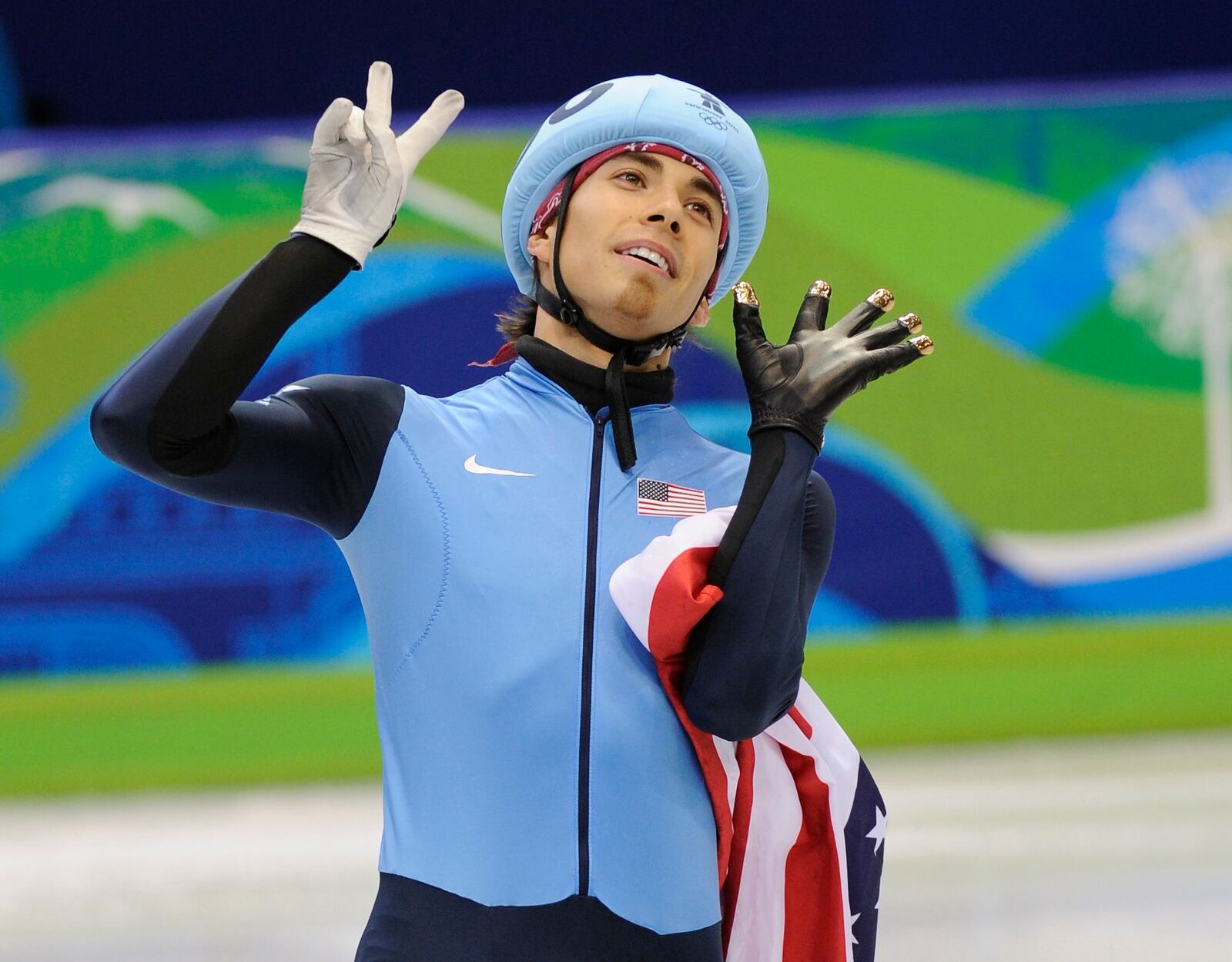 Ohno celebrates his record-breaking seventh career medal.