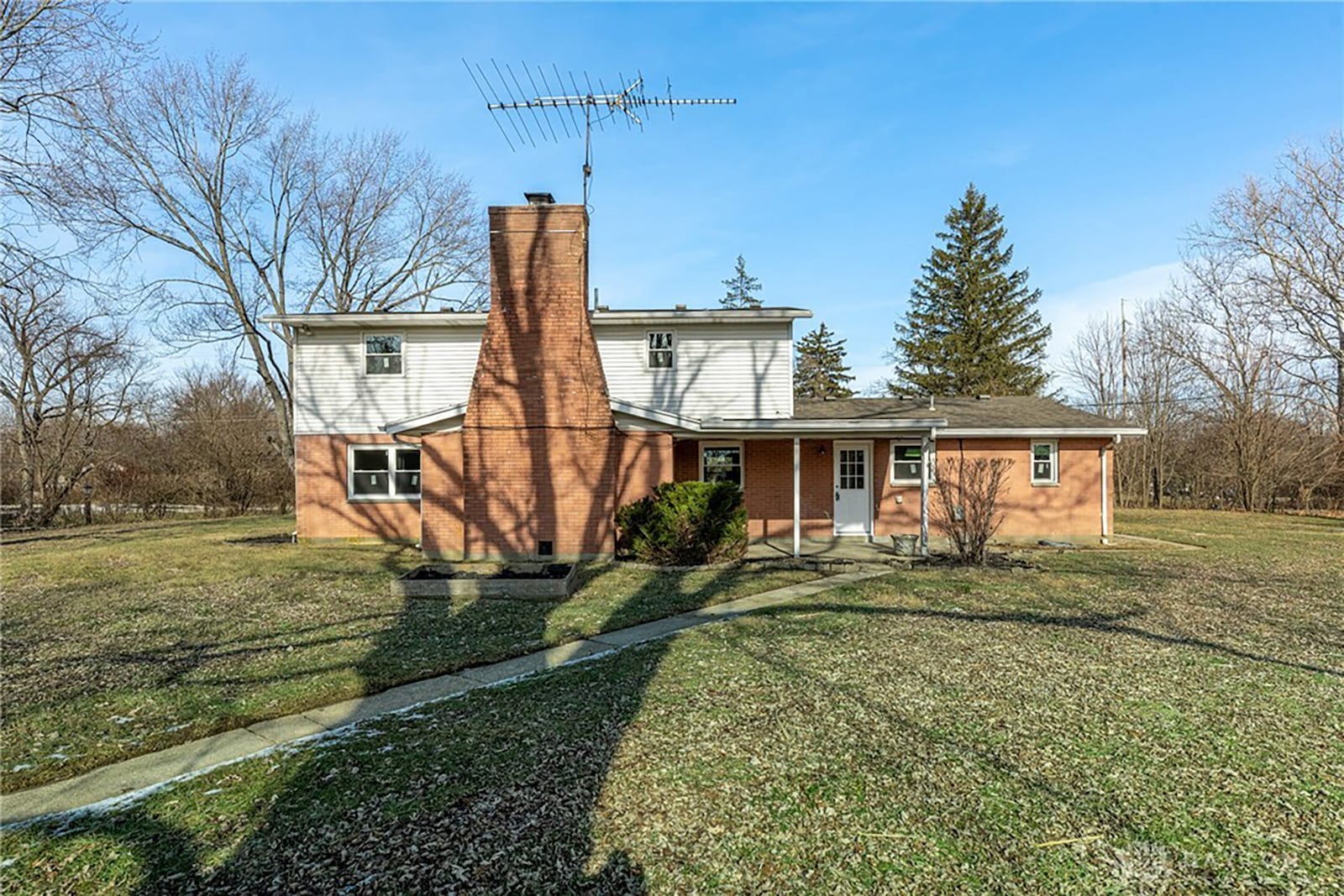 The back of the home has a covered patio with a walkway leading out to a barn/workshop with electricity. CONTRIBUTED