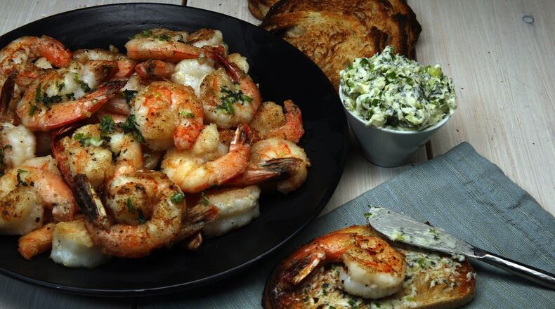 Shrimp are dusted with cornstarch before a quick spin in a hot skillet. The crispy crustaceans partner with a mint-chile butter. (Terrence Antonio James/Chicago Tribune/TNS)