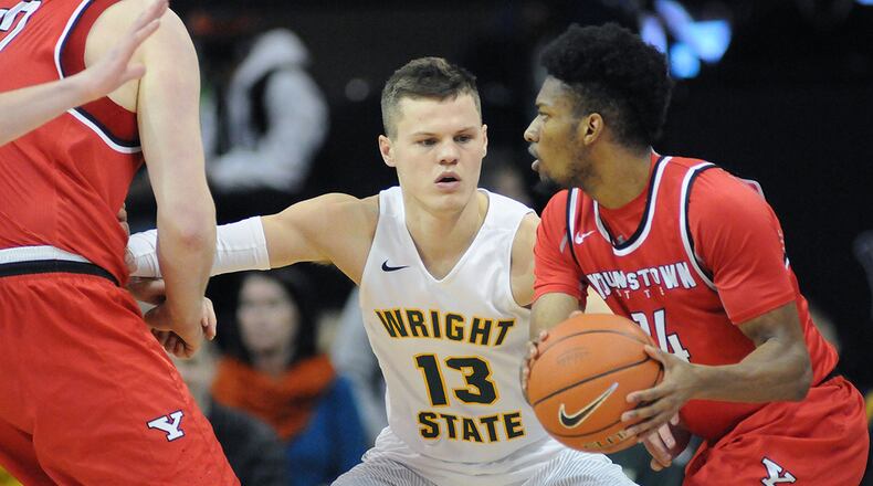 Wright State’s Grant Benzinger guards Youngstown State’s Cameron Morse in a game at the Nutter Center last season. KEITH COLE/CONTRIBUTED PHOTO