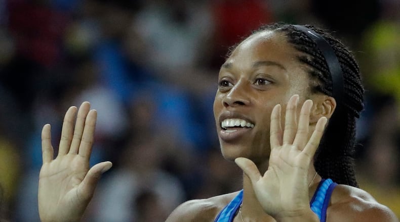 United States' Allyson Felix smiles after winning the gold in the women's 4x100-meter final during the athletics competitions of the 2016 Summer Olympics at the Olympic stadium in Rio de Janeiro, Brazil, Friday, Aug. 19, 2016. (AP Photo/Matt Dunham)