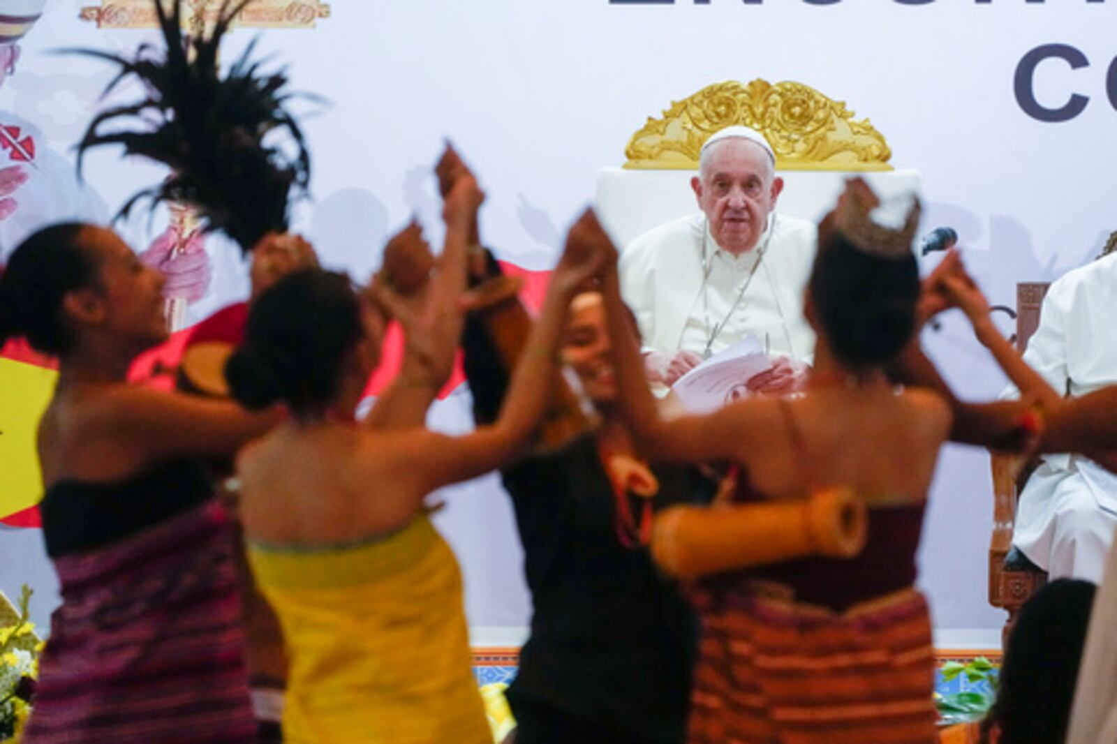 FILE - Pope Francis looks at traditional dancers as he arrives at the Centro de Convenções for a meeting with youths, in Díli, East Timor, Wednesday, Sept. 11, 2024. (AP Photo/Gregorio Borgia, file)