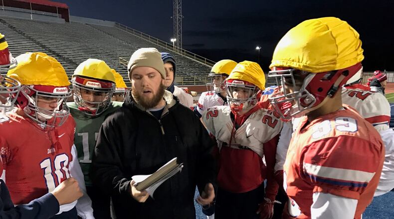 University of Dayton volunteer assistant coach Jeris Getter talks to players during a practice this week at Welcome Stadium. Tom Archdeacon/STAFF