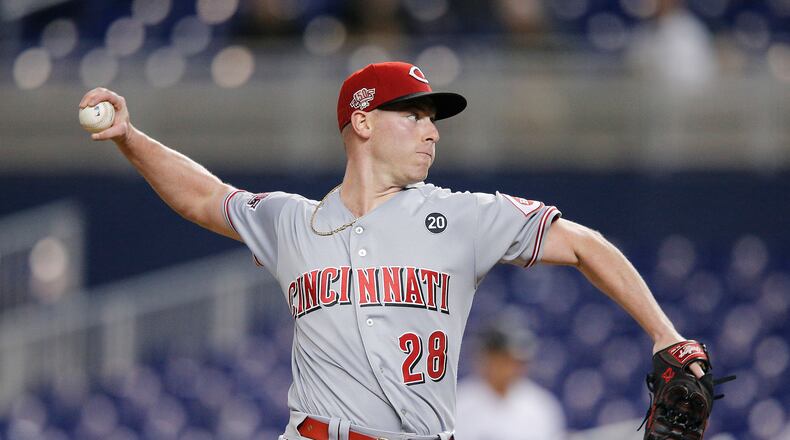 MIAMI, FLORIDA - AUGUST 28: Anthony DeSclafani #28 of the Cincinnati Reds delivers a pitch against the Miami Marlins during the first inning at Marlins Park on August 28, 2019 in Miami, Florida. (Photo by Michael Reaves/Getty Images)