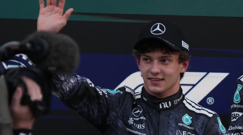 Mercedes driver Kimi Antonelli of Italy waves after the qualifying session of the Japanese Formula One Grand Prix at the Suzuka Circuit in Suzuka, Japan, Saturday, March 28, 2026. (AP Photo/Hiro Komae)