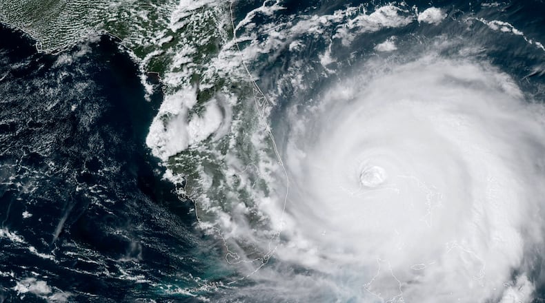 ATLANTIC OCEAN - SEPTEMBER 2: In this NOAA GOES-East satellite handout image, Hurricane Dorian, now a Cat. 4 storm, moves slowly past Grand Bahama Island on September 2, 2019 in the Atlantic Ocean. Dorian moved slowly past the Bahamas at times just 1 mph as it unleashed massive flooding and winds of 150 m.p.h. (Photo by NOAA via Getty Images)