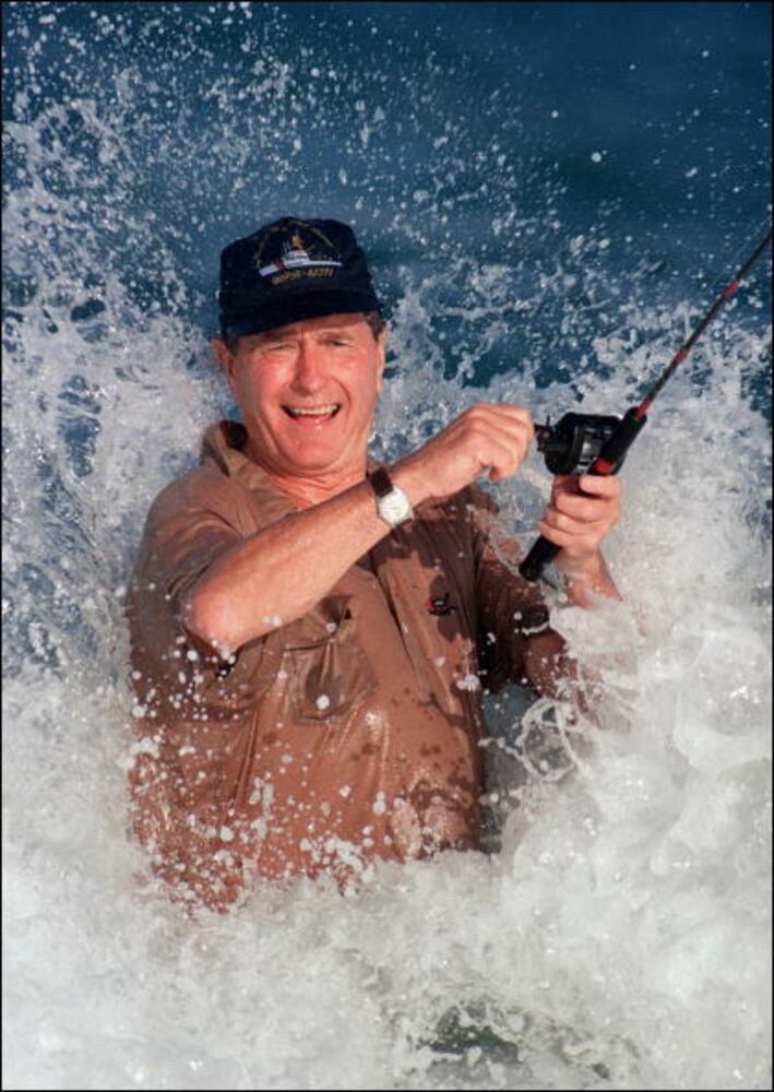 1988: George Bush is smashed by a wave while fishing in back of the home of William Farish in Florida