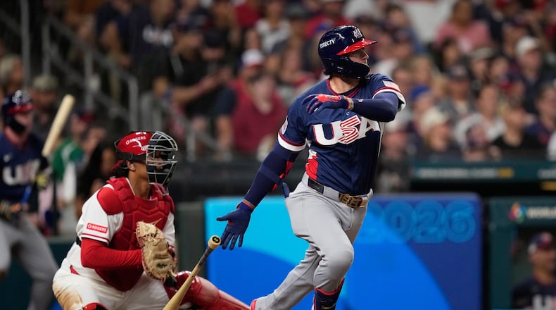 United States second baseman Brice Turang (13) hits an RBI single against Canada during the sixth inning of a World Baseball Classic quarterfinal game, Friday, March 13, 2026, in Houston. (AP Photo/David J. Phillip)