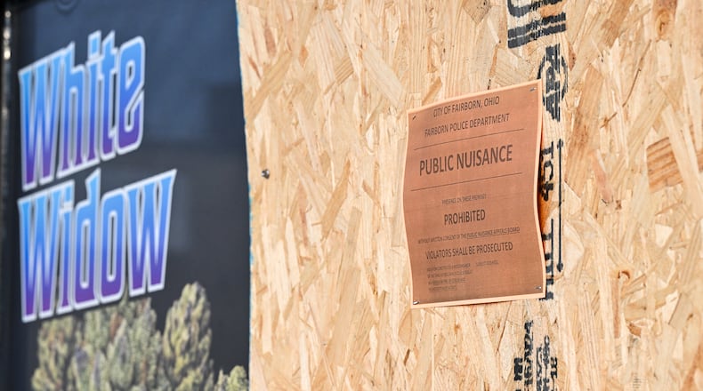 Bud City Dispo, a smoke shop located on Broad Street in Fairborn, was boarded up by Fairborn police a few days before Gov. Mike DeWine signed a bill on Dec. 19 that bans intoxicating hemp products. Stores the business operates in Chillicothe and Waverly were raided the same day Fairborn police conducted its raid. BRYANT BILLING/STAFF