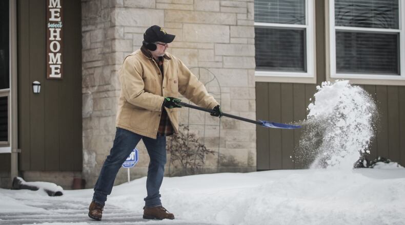 Montgomery County. resident, Mark Tarjan shovels his driveway Thursday morning. “Draconian” is how Mark Tarjan described the 43% increase in value on the home he owns with his wife Christine in Miami Twp. JIM NOELKER/STAFF