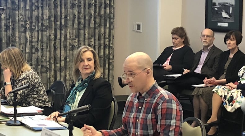 Wright State University president Cheryl Schrader sits next to faculty president Travis Doom during a faculty senate meeting at the school on Monday. Over the weekend and email began circulating calling for the senate to hold a vote of no confidence in Schrader.