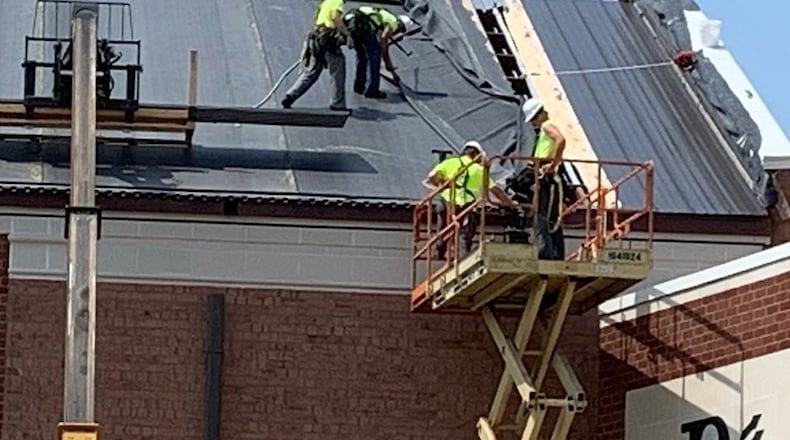 Roofers at Brookville High School switched their hours to escape the excessive heat. CONTRIBUTED