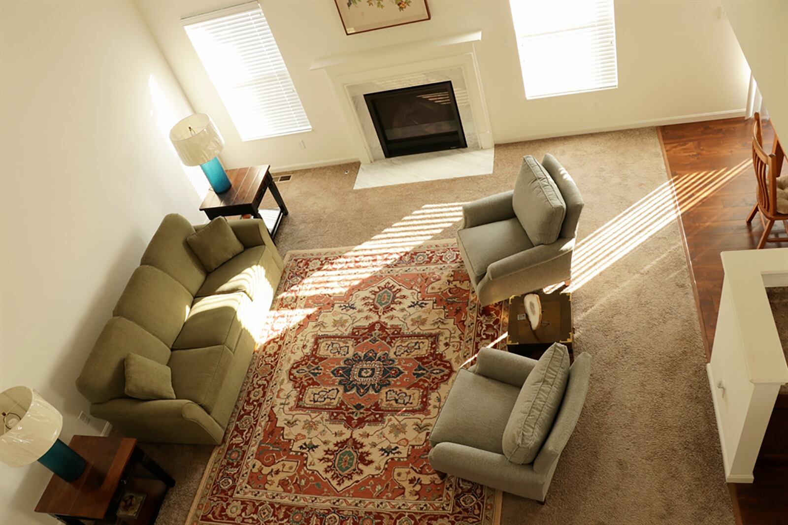 At the center of the house is the great room with a vaulted ceiling. Windows flank a gas fireplace, which has a fluted wood mantel and ceramic-tile hearth. Ceiling and flooring treatment separates the great room from the breakfast room and kitchen. CONTRIBUTED PHOTO BY KATHY TYLER