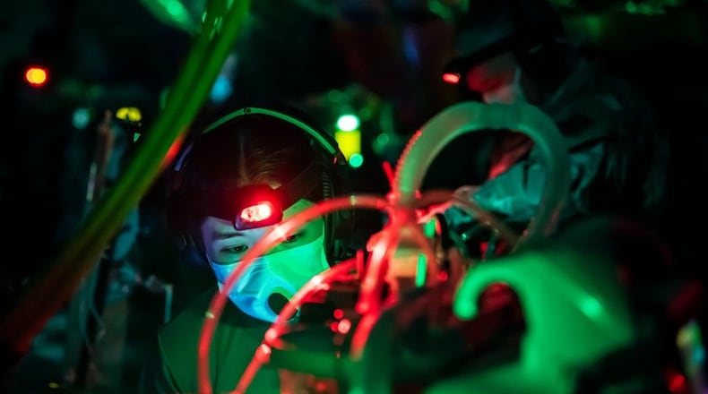 A respiratory therapist changes ventilator settings during a simulation at the Air Force School of Aerospace Medicine for the initial Critical Care Air Transport Team course at Wright-Patterson Air Force Base in May 2022. The school is part of the Air Force Research Laboratory’s 711th Human Performance Wing. (Air Force photo / Richard Eldridge).