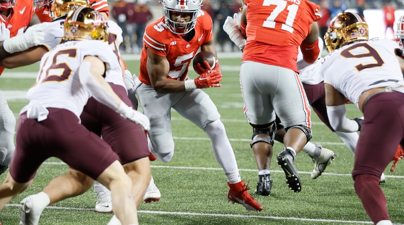 Ohio State running back Dallan Hayden (5) runs the ball against Minnesota during the second half of an NCAA college football game Saturday, Nov. 18, 2023, in Columbus, Ohio. (AP Photo/Jay LaPrete)
