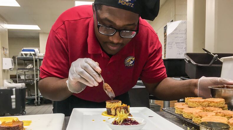 Table 33, 130 W. Second St. in downtown Dayton, will host Pave the Path: A Ponitz Collaborative Pop-Up 6 p.m. The event is a fundraiser for a senior trip to European for students in the Ponitz Culinary Program at David H Ponitz Career Technology Center in Dayton. Senior Keiontae Boykin practices the dessert course.