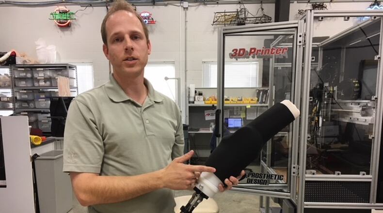 Brad Poziembo, a prosthetist for Dayton Artificial Limb, talks about harnessing 3-D printing in his business and industry. THOMAS GNAU/STAFF